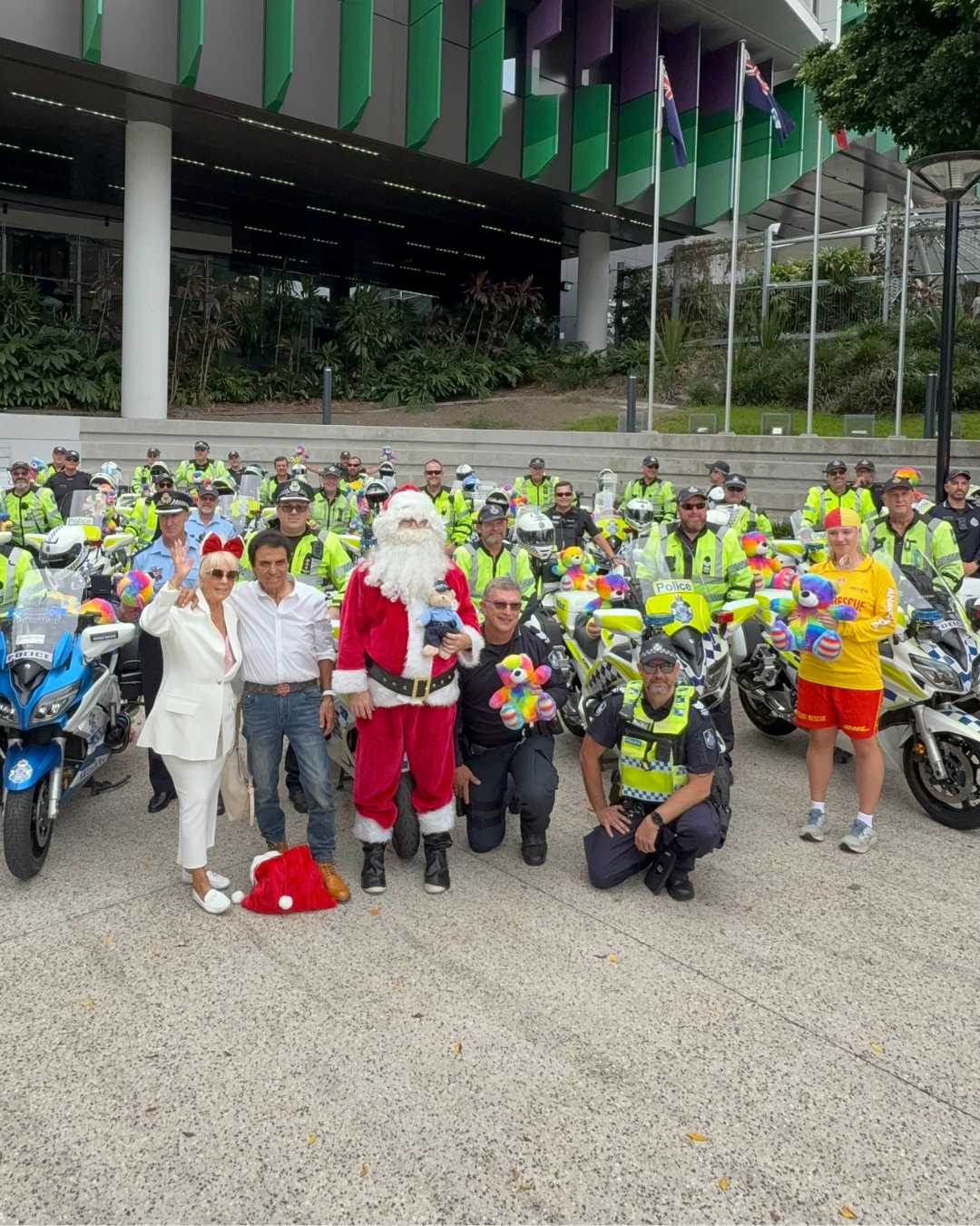 Stefan Ackerie, Rose King and Santa with the QLD Motorcycle Police and QLD Surf Life Savers  